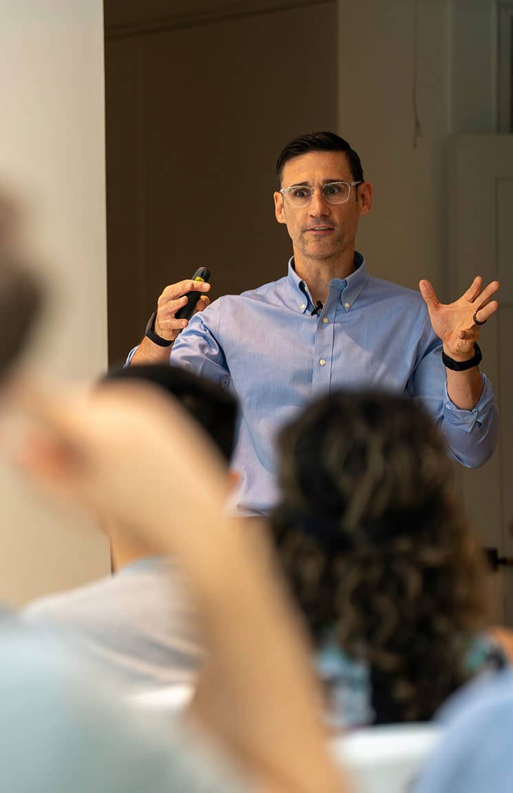 Dr Nick Barringer, ranger dietitian and human performance consultant, speaks to a large crowd